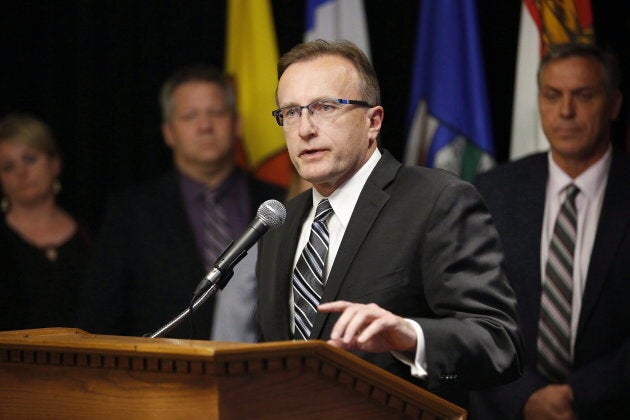 Jim Reiter, Saskatchewan Minister of Health, responds to a reporter's questions at a press conference during the Conferences of Provincial-Territorial Ministers of Health in Winnipeg in June 2018.
