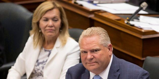 Ontario Premier Doug Ford sits next to Health Minister Christine Elliott during question period at Queen's Park in Toronto on July 31, 2018.