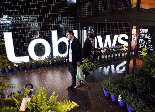 File photo of a shopper leaving a Loblaws store in Toronto on May 3, 2018.