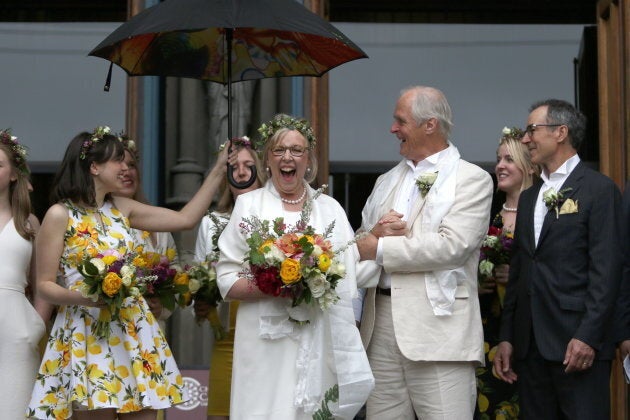 May and Kidder greet the crowd as her daughter Cate holds an umbrella at the Christ Church Cathedral in Victoria, B.C., on April 22, 2019.