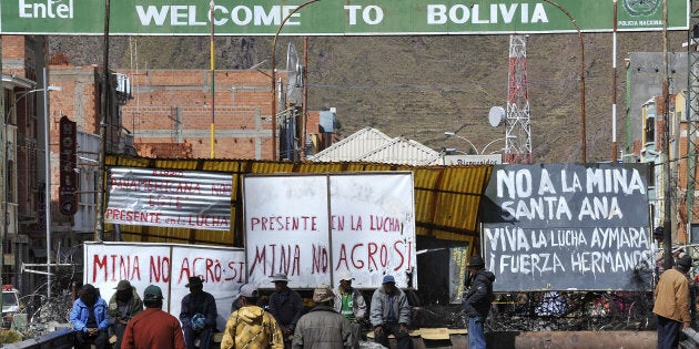 In this file photo taken May 24, 2011, Peruvian protesters block a bridge connecting Peru and Bolivia in Desaguadero, Peru, to oppose to the Canadian-owned Santa Ana silver mining project they said would pollute nearby lakes and rivers.