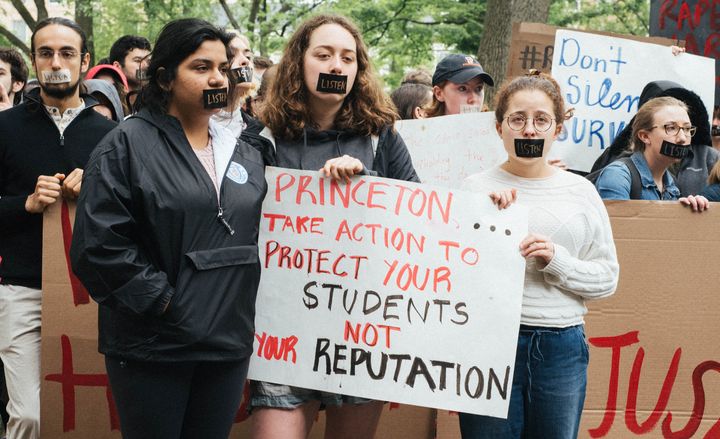 Princeton University students stage a silent protest in front of the president's office.