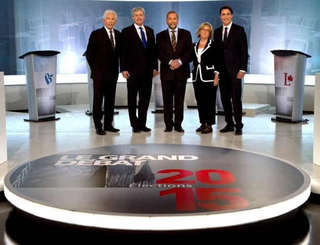 Flashback — From to left to right, former Bloc Quebecois leader Gilles Duceppe, ex-Conservative leader Stephen Harper, ex-NDP leader Tom Mulcair, Green Party Leader Elizabeth May and Liberal Leader Justin Trudeau pose for photos before the French-language leaders' debate in Montreal on September 24, 2015.