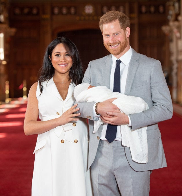 he Duke and Duchess of Sussex with their baby son, who was born on Monday morning, during a photo call in St George's Hall at Windsor Castle in Berkshire.