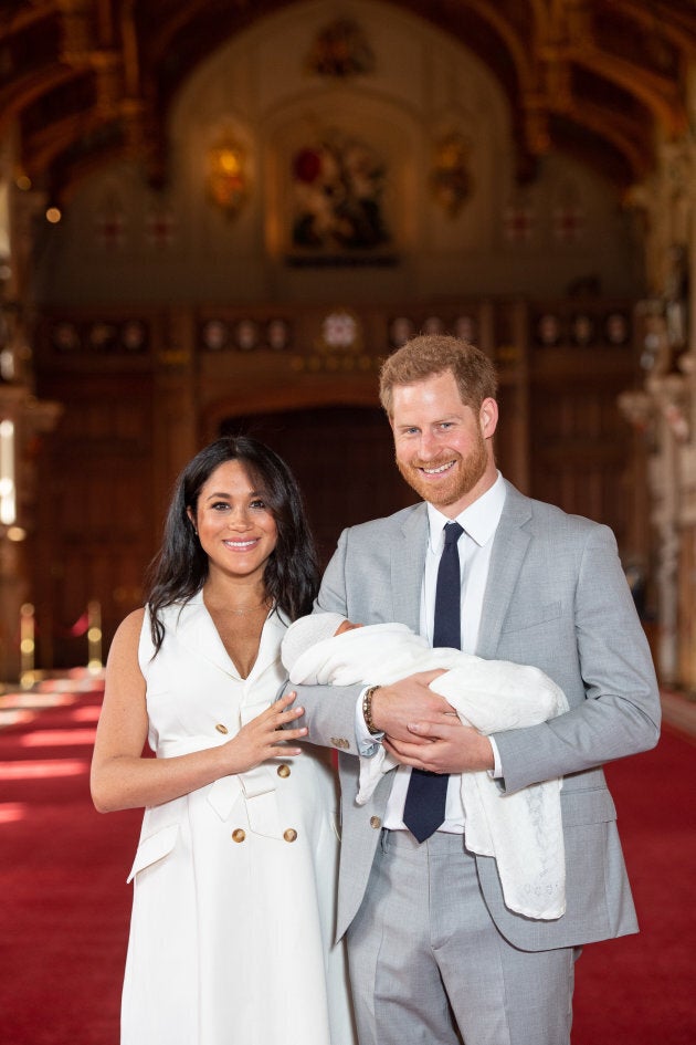 The Duke and Duchess of Sussex with their baby son, who was born on Monday morning, during a photo call in St George's Hall at Windsor Castle in Berkshire.