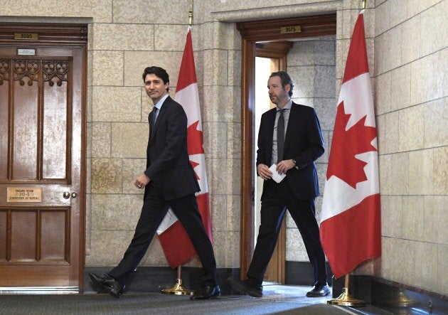 Prime Minister Justin Trudeau leaves his office with Gerald Butts to attend an emergency cabinet meeting on Parliament Hill on April 10, 2018.