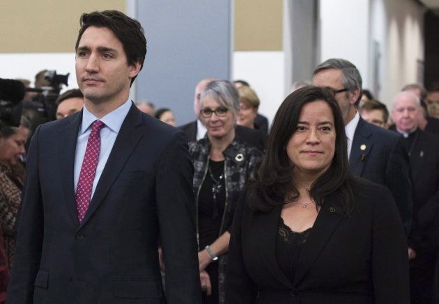 Prime Minister Justin Trudeau and Jody Wilson-Raybould take part in the grand entrance as the final report of the Truth and Reconciliation commission is released on Dec. 15, 2015 in Ottawa.