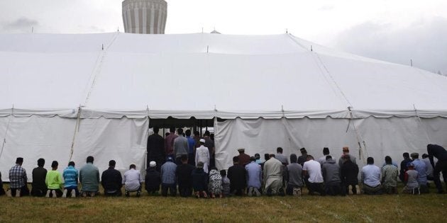 Worshippers take part in afternoon prayers on the last Friday of Ramadan at the Baitul Islam Mosque in Vaughan, Ont., prior to Canada Day festivities on July 1, 2016.