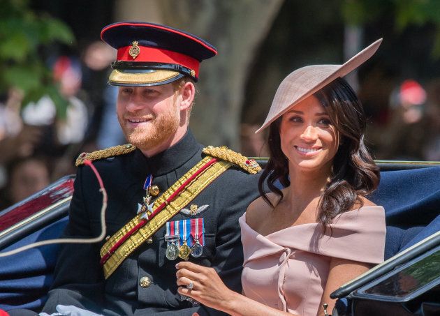 The Duke and Duchess of Sussex ride by carriage during Trooping The Colour 2018 on June 9 in London.