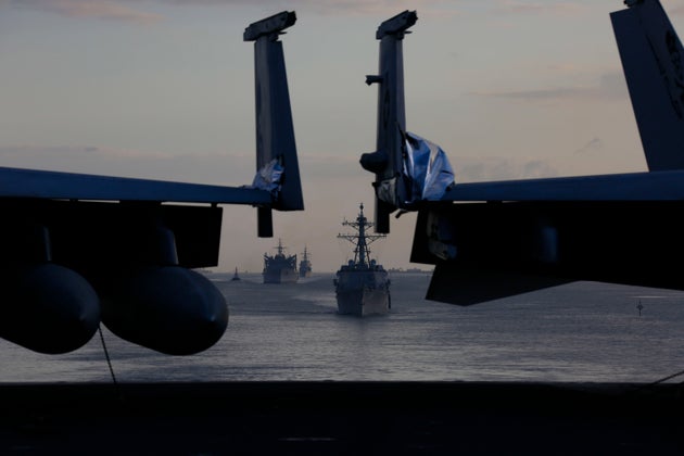 A photo released by the U.S. Navy shows part of the strike group being deployed to the Persian