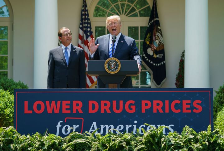 Trump, right, speaks at an event about lowering prescription drug prices. His patent office chief's speech at a fundraiser backed by Big Pharma raises questions about his commitment.