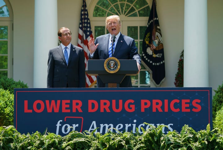 Trump, right, speaks at an event about lowering prescription drug prices. His patent office chief's speech at a fundraiser ba