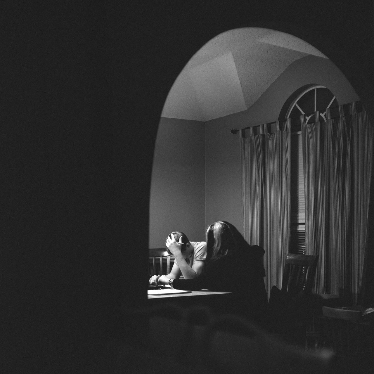 Logan puts his hand on his head in frustration as he and his mother tackle his schoolwork. He spent nearly two years at a therapeutic boarding school but left because of "lack of progress" and safety concerns about his aggressive behavior, according to his exit report.