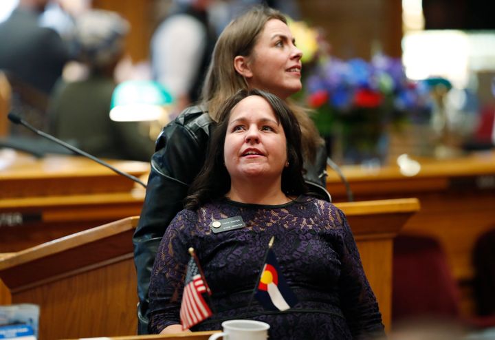 Colorado state Sen. Faith Winter, foreground, as new lawmakers are sworn in at the Colorado State Capitol on Friday, Jan. 4, 2019, in Denver.