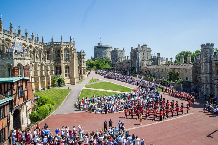 Crowds gathered in front of Windsor Castle to watch the royal wedding on May 19, 2018.