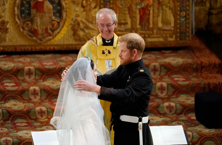 The archbishop of Canterbury Justin Welby declares Harry and Meghan husband and wife.