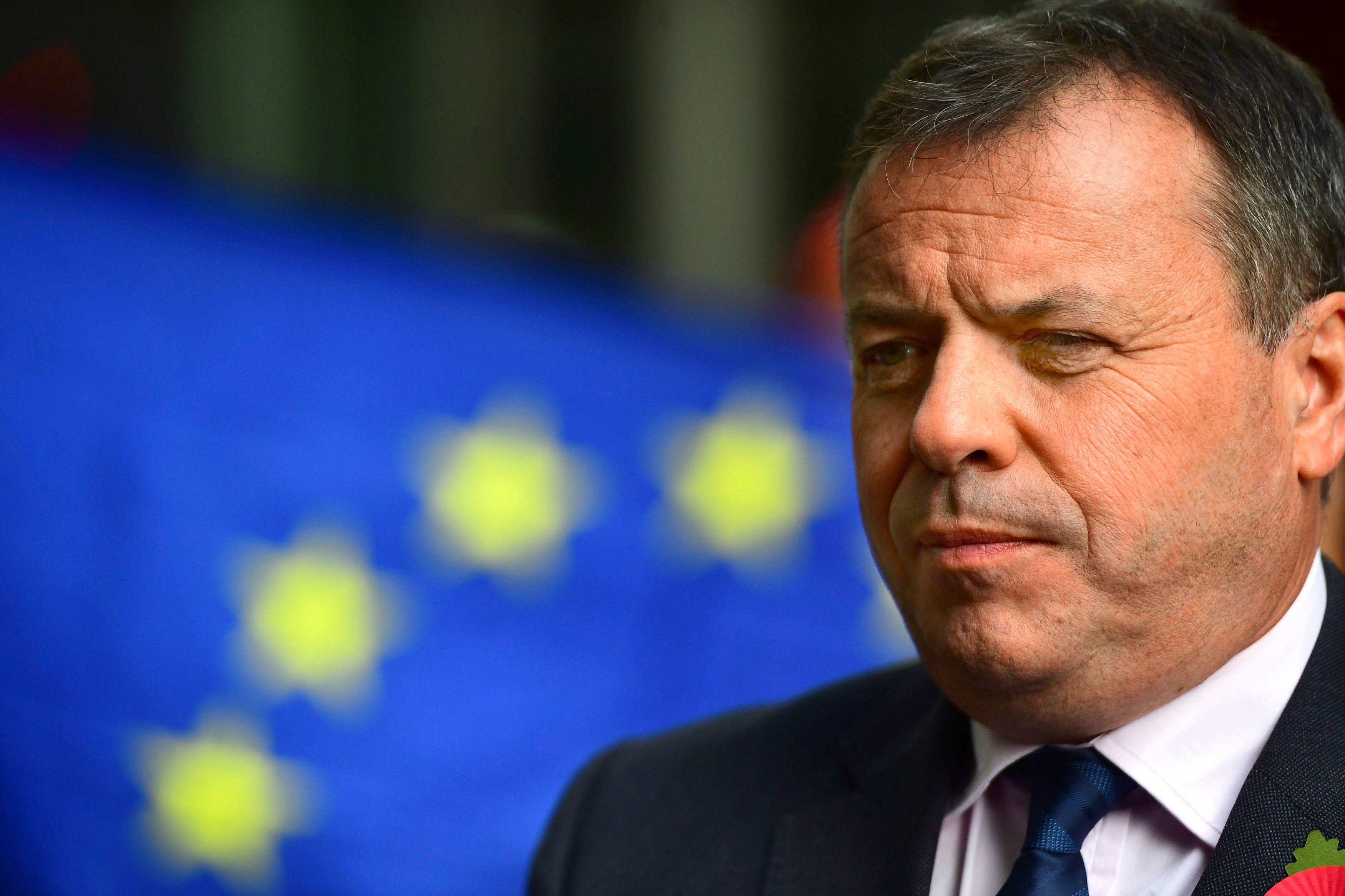 Leave campaigner and businessman Arron Banks, centre, speaks to the media outside BBC Broadcasting House in London, after appearing on the Andrew Marr show, in London, Sunday, Nov. 4, 2018. Britain's National Crime Agency is investigating a main financial backer of the campaign to get Britain out of the European Union over suspected illegal funding during the country's EU membership referendum, authorities said Thursday. (Victoria Jones/PA via AP)