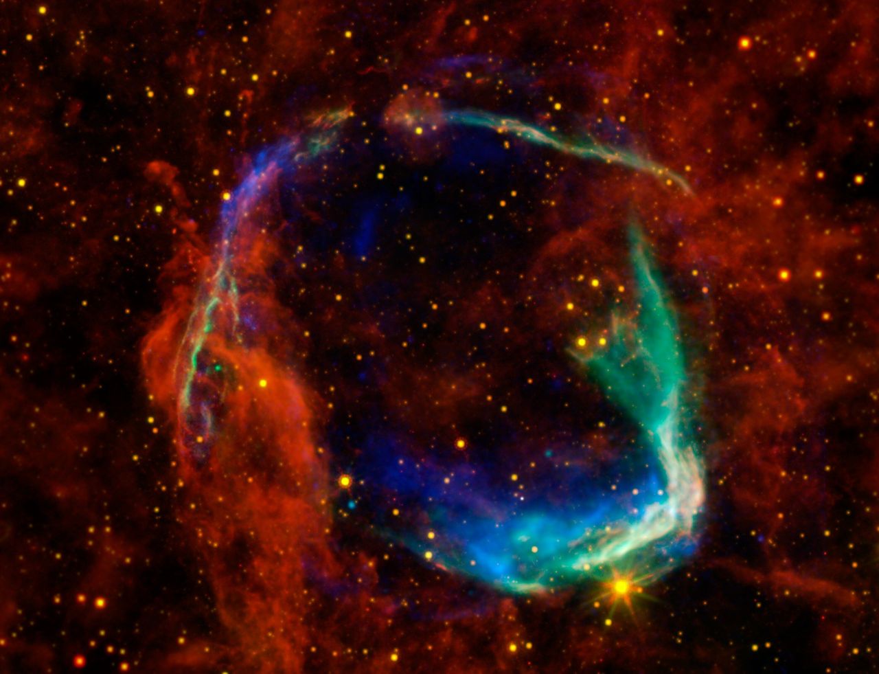 Infrared images from NASA's Spitzer Space Telescope and Wide-field Infrared Survey Explorer (WISE) are combined in this image of RCW 86, the dusty remains of the oldest documented example of an exploding star, or supernova.