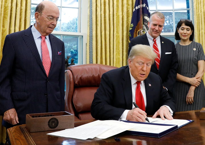 President Donald Trump signing the Save Our Seas Act in the Oval Office on Oct. 11, 2018.