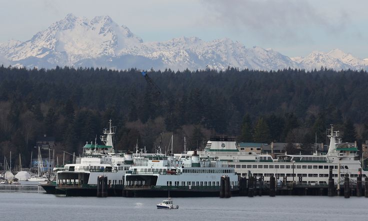 Ferries dock at Bainbridge Island, Washington, with the Olympic Mountains in the background.