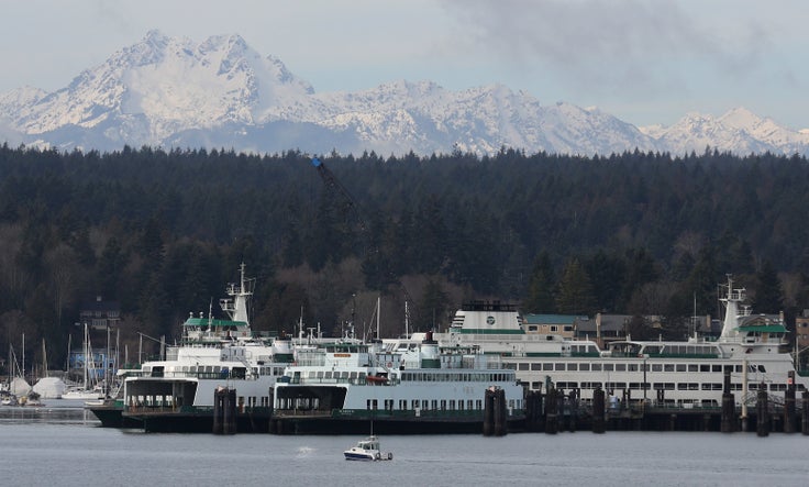 Ferries dock at Bainbridge Island, Washington, with the Olympic Mountains in the background.