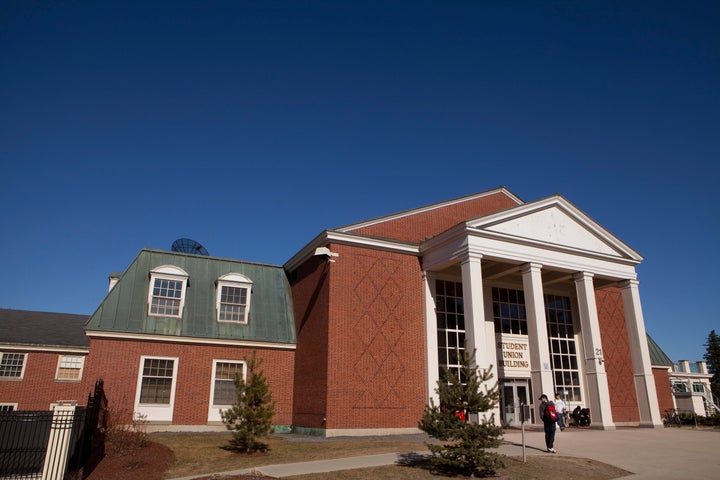 Students hang out by the University of New Brunswick Student Union building in Fredericton on April 3, 2012.