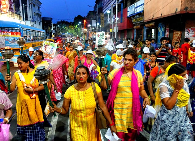 Sex workers seen walking with torches during the rally with a demand of dignity, Labor Right & Social...