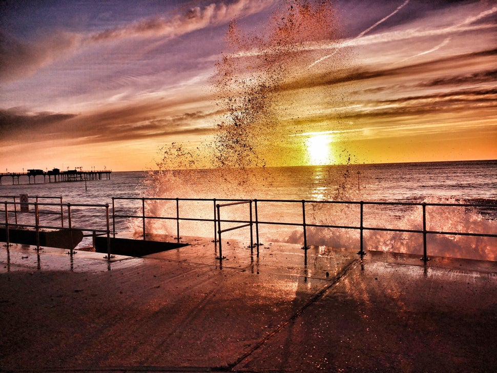 Wild sea: Sea water cascades over the pier in this shot, taken in Teignmouth, Devon.