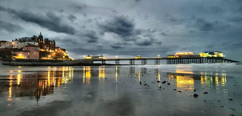 A race against the falling light: Taken at dusk at Cromer Pier, Haverhill.