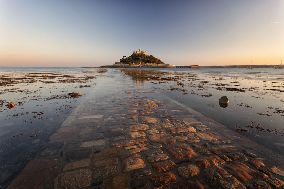 Late evening light bounces from the causeway in this shot of St Michaels Mount, Cornwall. 