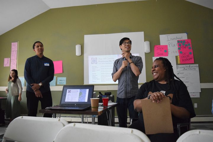 (Left to right) Lucas Turner-Owens, Aaron Tanaka and Ujima director Nia Evans lead one of the community assemblies where residents help determine Ujima’s investment plans.