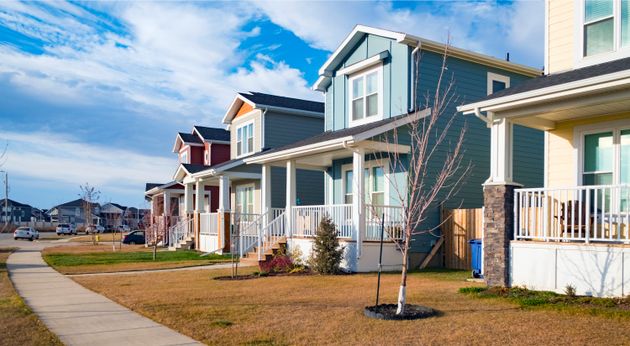 A row of new single family houses in a neighbourhood in Saskatoon, which Moody's Analytics says will...