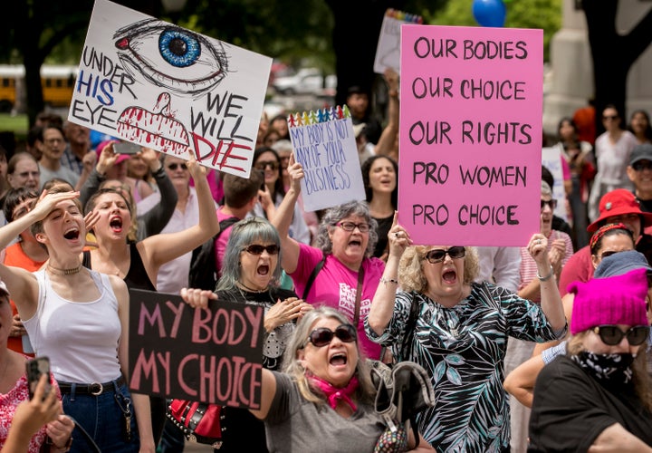 Abortion rights advocates rally at the Capitol in Austin, Texas, on Tuesday to oppose state laws that impose strict restrictions on abortion.