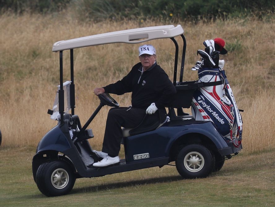 President Donald J. Trump  at the golf course.  Photograph: Andrew Milligan/Press Association Images/via Getty Images.