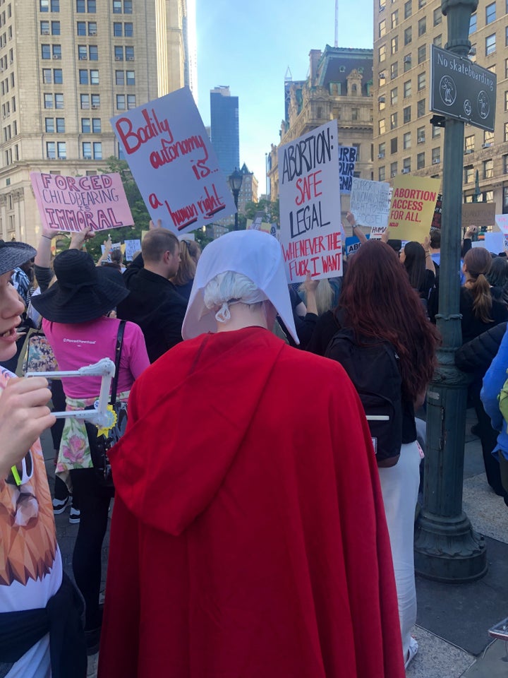 A protester dressed in a "Handmaid's Tale" outfit at the Foley Square #StopTheBans protest in New York City.