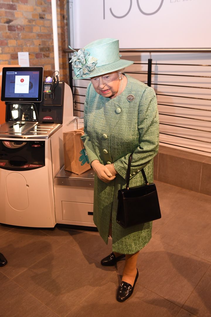 Her Majesty was shown a replica of a Sainsbury's self-service till on a visit to a pop-up store.