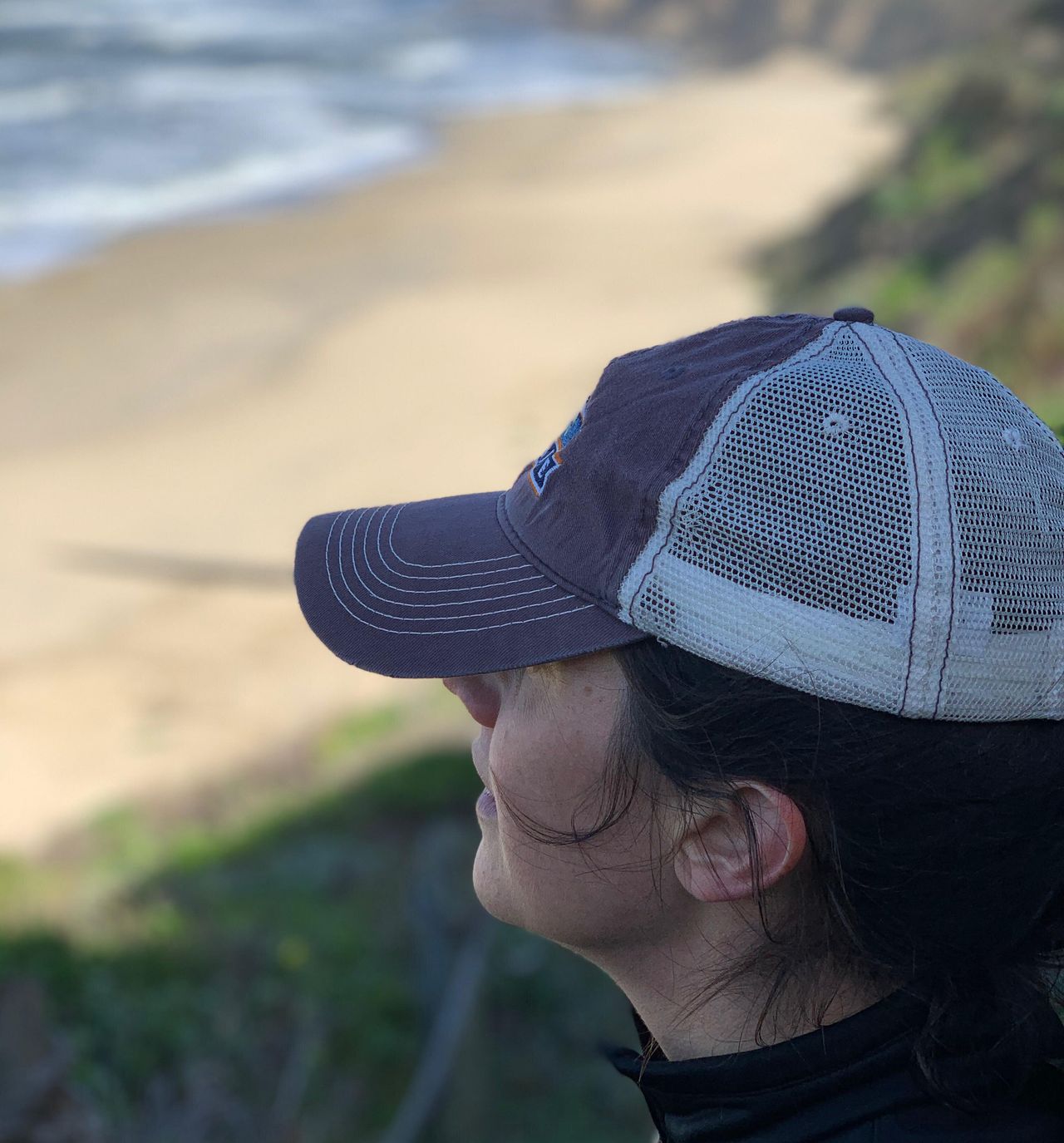Reilly looking out over a beach near Half Moon Bay, California, on the day she and Peter threw sand into the ocean as their way of saying goodbye to Ceol (April 2019).