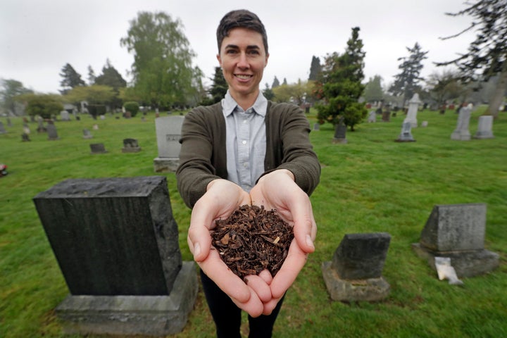 Katrina Spade, the founder and CEO of Recompose, displays a sample of compost material left from the decomposition of a cow. It would take about a month to break down a human body.