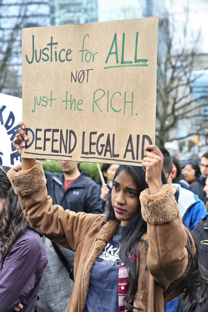 Lawyers and doctors along with members of the community gathered at Queen's Park to protest cuts to the Legal Aid Ontario May 7, 2019. 