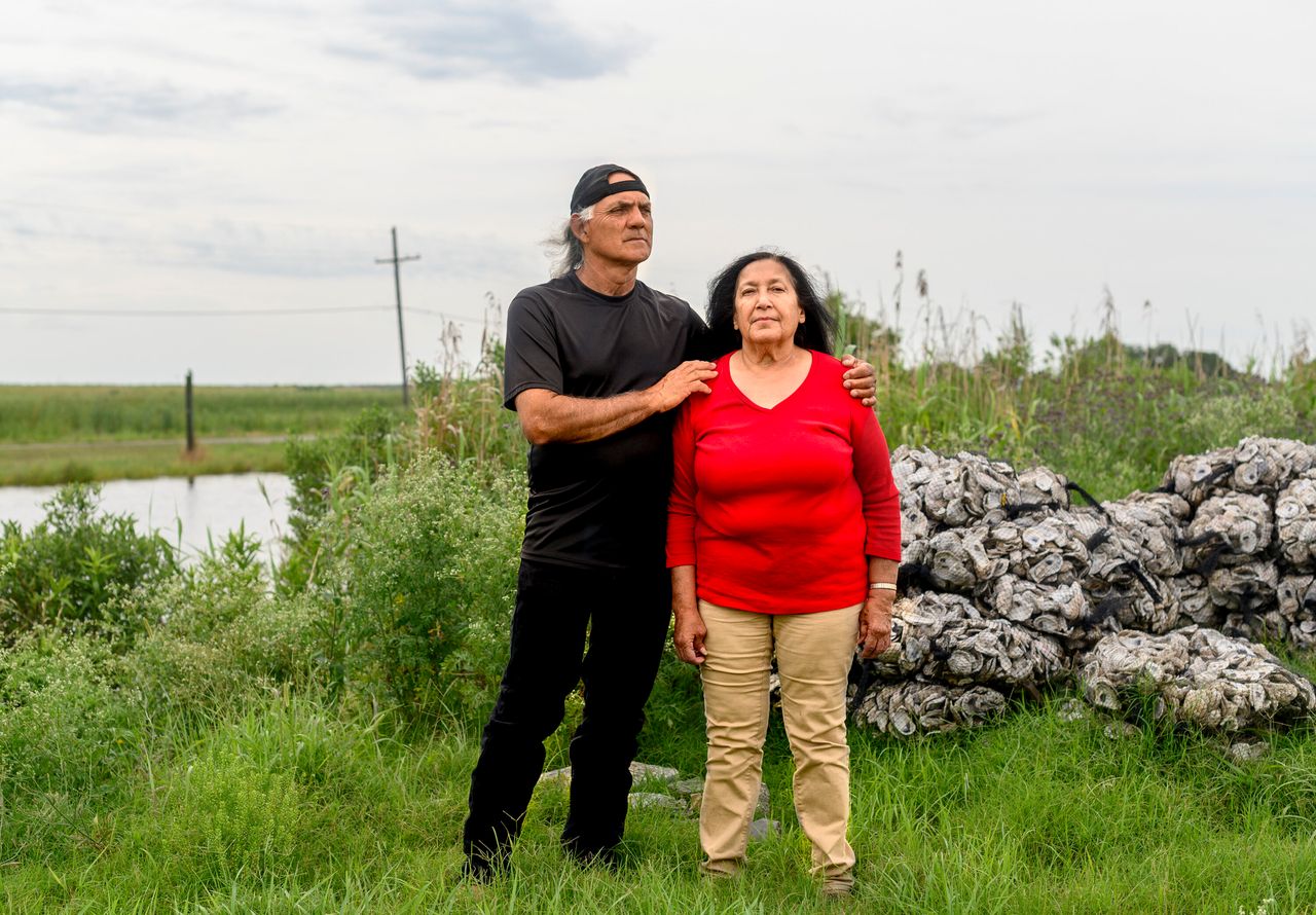 Theresa and Donald Dardar pose for a portrait in the Pointe-au-Chien community in Lafourche Parish, Louisiana., on May 19, 2019.