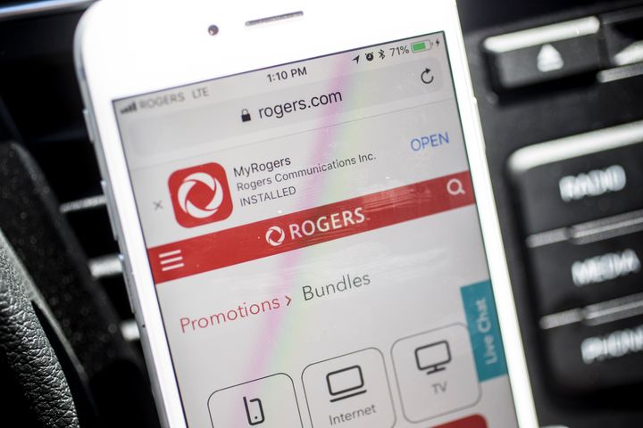 This photo taken in July 2018 shows an iPhone visiting the Rogers website, where wireless promotions and bundles are available for purchase. A report prepared for Rogers says "MVNOs have had no statistically significant impact on retail prices."
