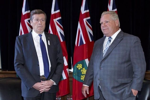 Toronto Mayor John Tory and Ontario Premier Doug Ford stand for a photo opportunity in the premier's Queen's Park office in Toronto on Dec. 6, 2018. 