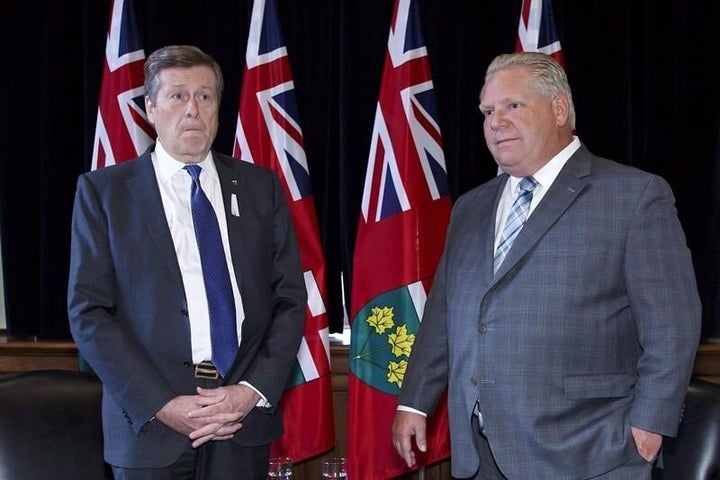 Toronto Mayor John Tory and Ontario Premier Doug Ford stand for a photo opportunity in the premier's Queen's Park office in Toronto on Dec. 6, 2018.
