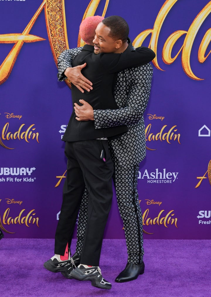 Will Smith hugging his son Jaden after his arrival.