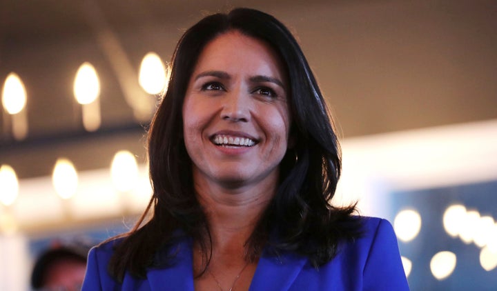 Presidential hopeful Rep. Tulsi Gabbard smiles during a campaign stop at a brewery in Peterborough, New Hampshire, on March 22.