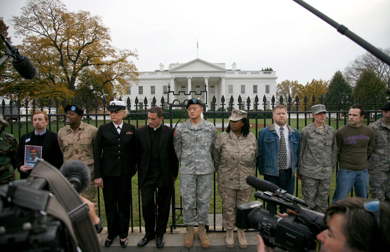 Lt. Dan Choi (center) and others handcuff themselves to the fence outside the White House on Nov. 15, 2010, to demand that Obama keep his promise to repeal "don't ask, don't tell."