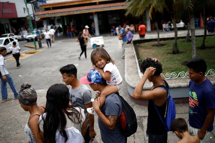 Central American migrants wait in line as nuns from Misioneras de Cristo Resucitado deliver bread at Miguel Hidalgo Central Park in Tapachula, Mexico on May 15, 2019.