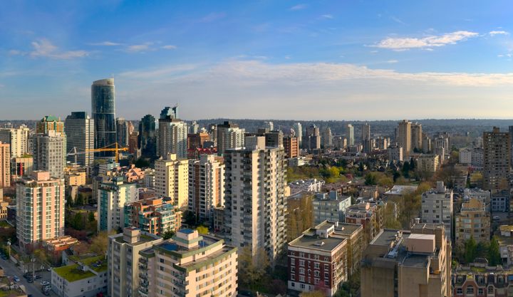 An aerial view of apartment and condo buildings in Vancouver's West End, with Robson Street on the right.