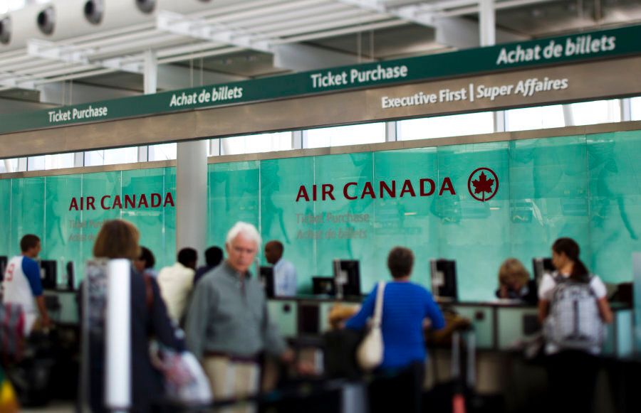 Travellers wait at the Air Canada counter at Toronto Pearson International Airport on Aug. 30, 2011.