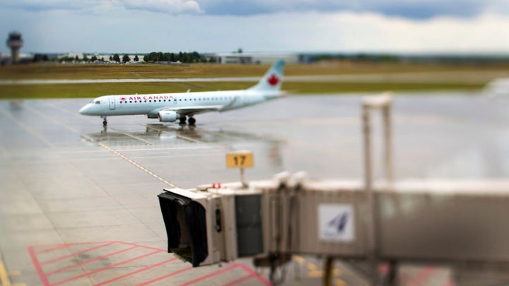 An Air Canada airplane taxis down the tarmac at Ottawa International Airport on Aug. 10, 2011.